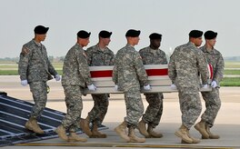 A U.S. Army carry team transfers the remains of Army Staff Sgt. Sonny C. Zimmerman of Waynesfield, Ohio, July 18, 2013, at Dover Air Force Base, Del.  Zimmerman was assigned to the 1st Battalion, 506th Infantry, 4 Brigade Combat Team, Fort Campbell, Ky. (U.S Air Force photo by Senior Airman Melanie Bulow-Kelly/Released)