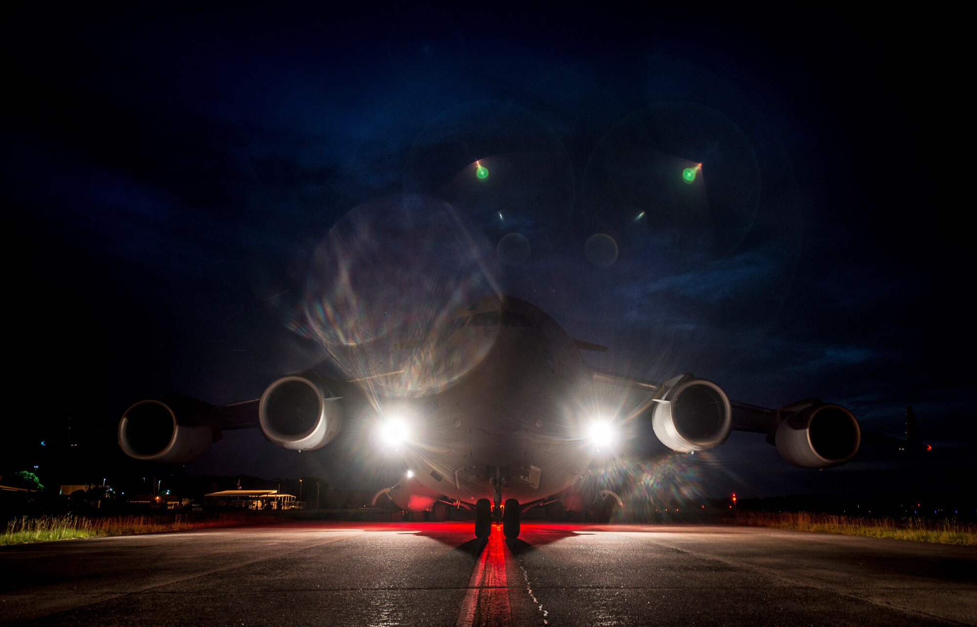 A C-17 Globemaster III taxis to the runway before taking off to perform “touch and goes” July 17, 2013, at Joint Base Charleston – Air Base, S.C. Airmen from the 437th Airlift Wing work around the clock on the flightline to provide combat-ready C-17A aircrews, mission support personnel and processes for 53 assigned aircraft to meet White House, Department of State and Joint Chiefs of Staff-directed global deployment, employment and resupply of Department of Defense and allied forces via air-land and airdrop operations. (U.S. Air Force photo/ Senior Airman Dennis Sloan)