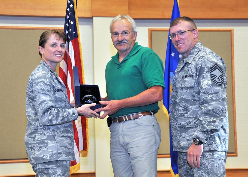 Royce A. Shipley, 341st Civil Engineer Squadron, center, was named Malmstrom AFB's Non-Supervisor Category Two Civilian of the Quarter for the second quarter of 2013.  Shown presenting the award are Col. Marné Deranger, 341st Missile Wing vice commander, and Chief Master Sgt. Ronald Beadles, 341st Medical Group chief enlisted advisor.  The presentation was made at the Wing Quarterly Awards breakfast held July 16 at the Grizzly Bend.  (U.S. Air Force photo/ John Turner)