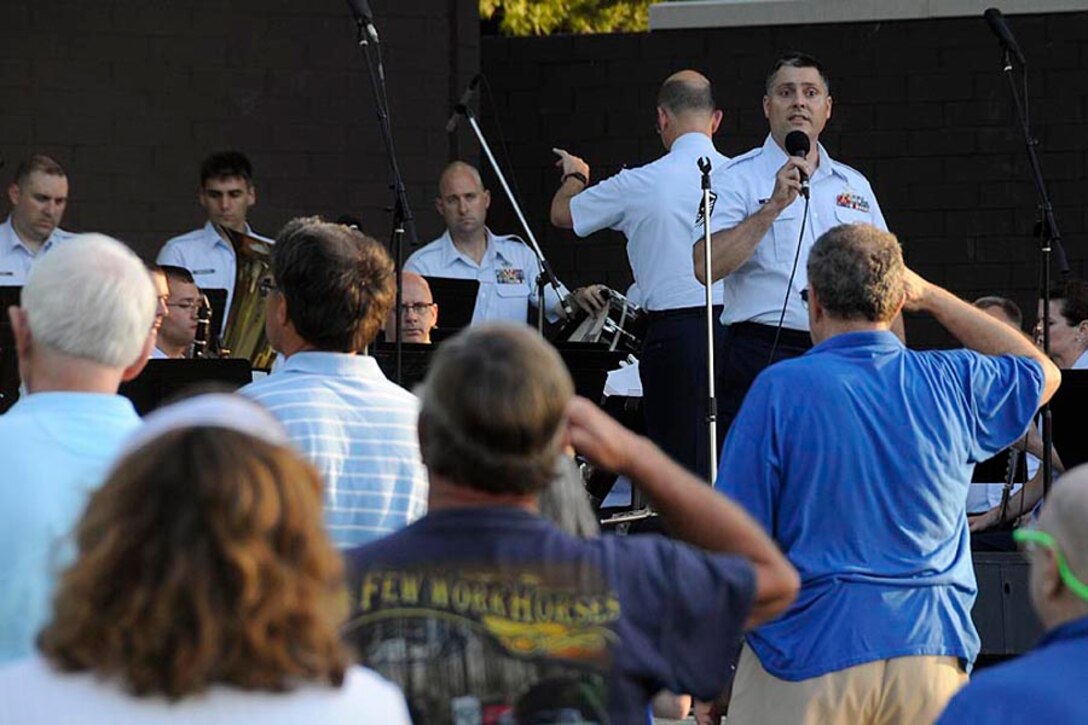 MSgt Doug Mattsey sings the National Anthem with the band.

Photo courtesy of TSgt Todd Pendleton, 182nd AW Public Affairs
