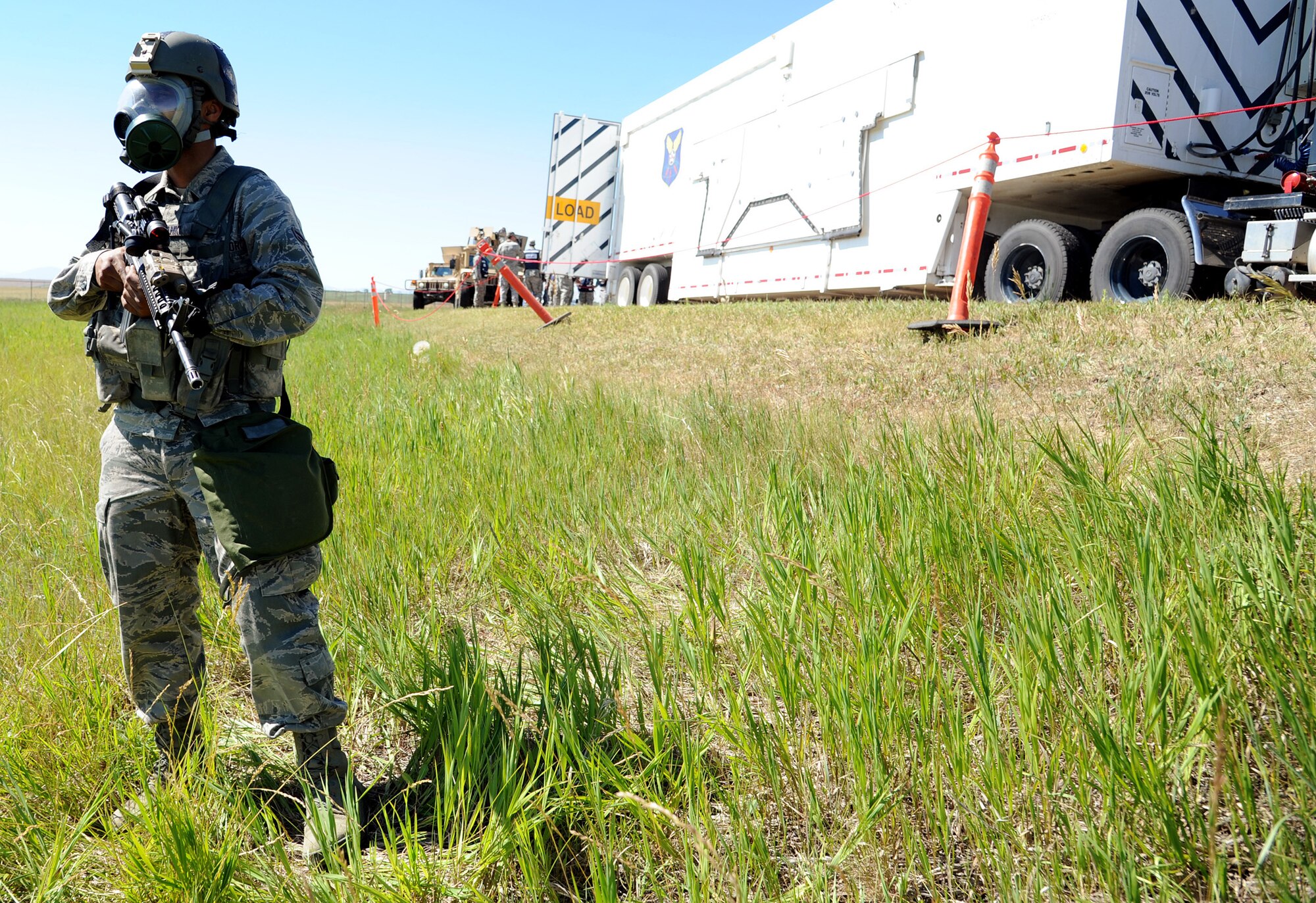 Airman 1st Class Kaushal Solanki, 741st Missile Security Forces Squadron member, mans the cordon at an exercise scene July 10 on Perimeter Road. Cordons are established to protect individuals from unnecessary harm to themselves or the incident scene. (U.S. Air Force photo/Staff Sgt. R.J. Biermann)
