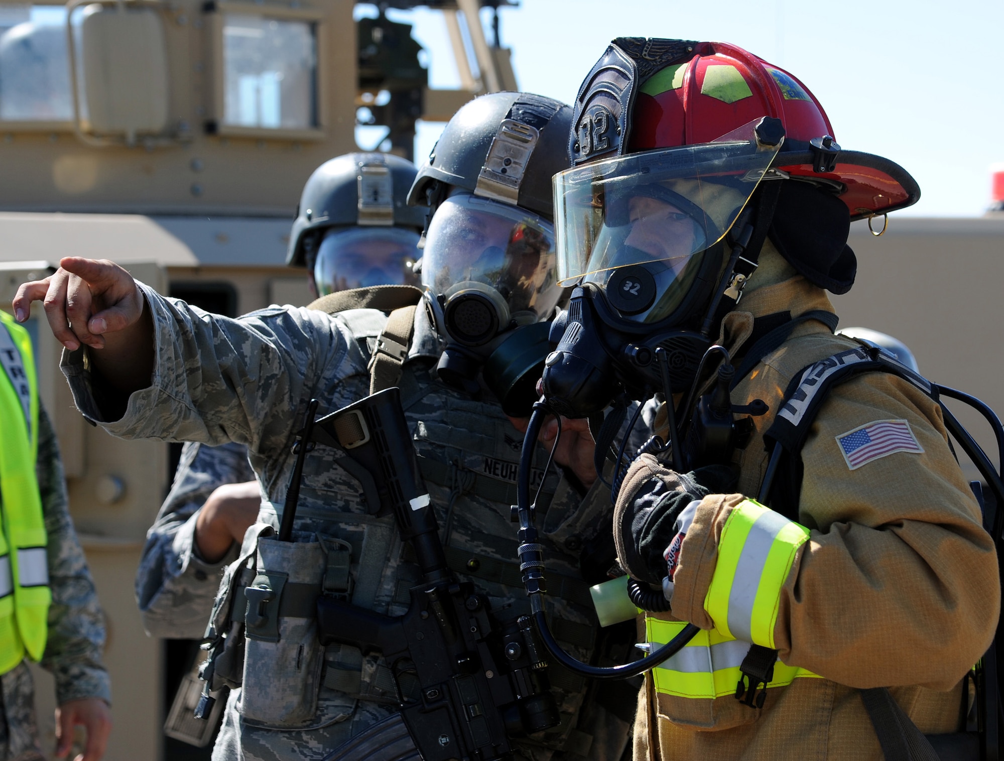 Emergency first responders assigned to the 341st Missile Wing discuss the scene of an exercise incident July 10 on Perimeter Road. Exercises and inspections help to prepare Team Malmstrom members for real-world emergencies, should they ever occur. (U.S. Air Force photo/Staff Sgt. R.J. Biermann)