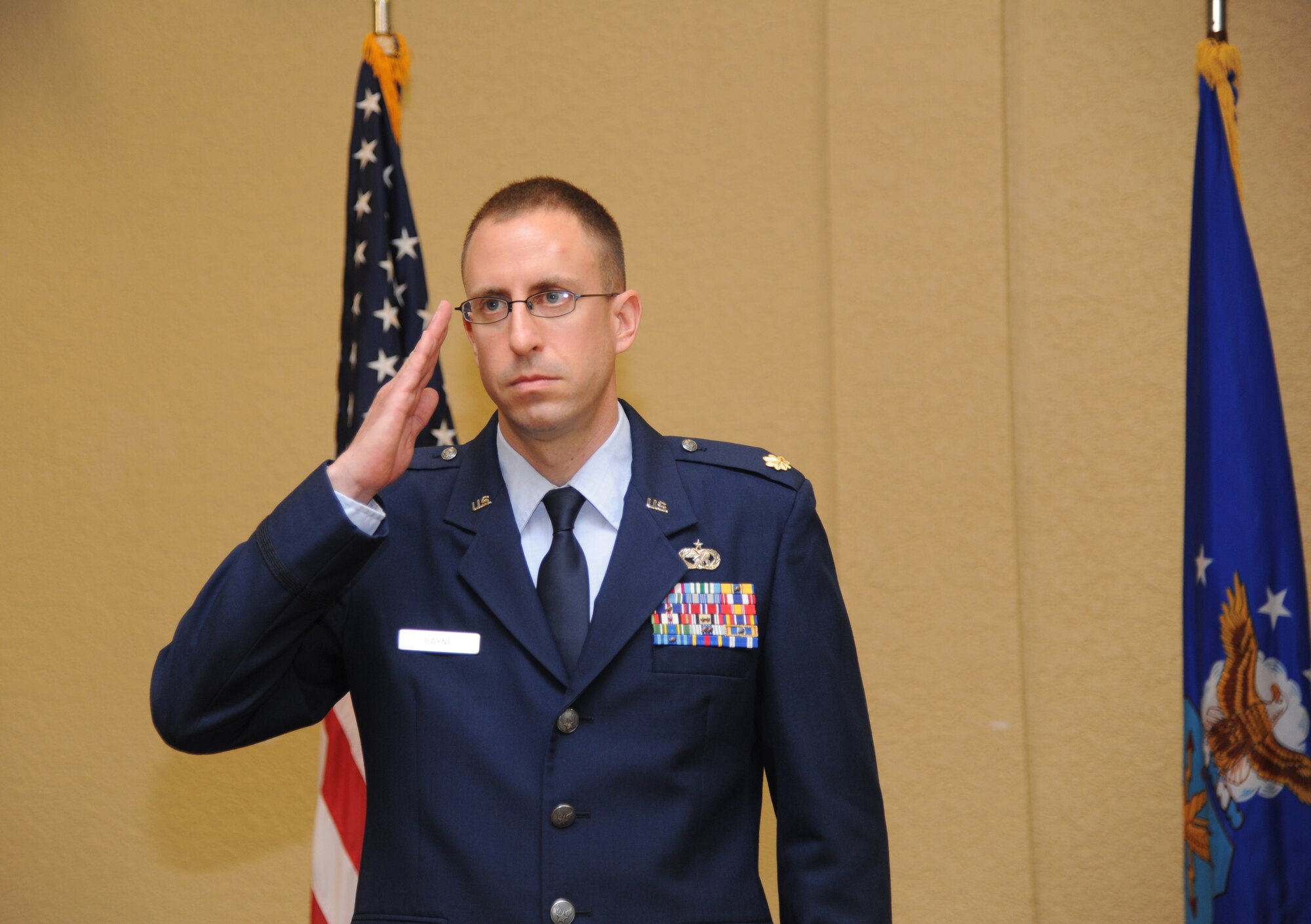 Maj. Cliff Bayne, incoming 81st Logistics Readiness Squadron commander, returns a first salute to Airmen in the 81st LRS during a change of command ceremony July 18, 2013, at the Bay Breeze Event Center, Keesler Air Force Base, Miss. Col. Mark Vivians, 81st Mission Support Group commander, was the officiating officer for the event and Lt. Col. Stephen Wier was the outgoing 81st LRS commander.  (U.S. Air Force photo by Kemberly Groue)
