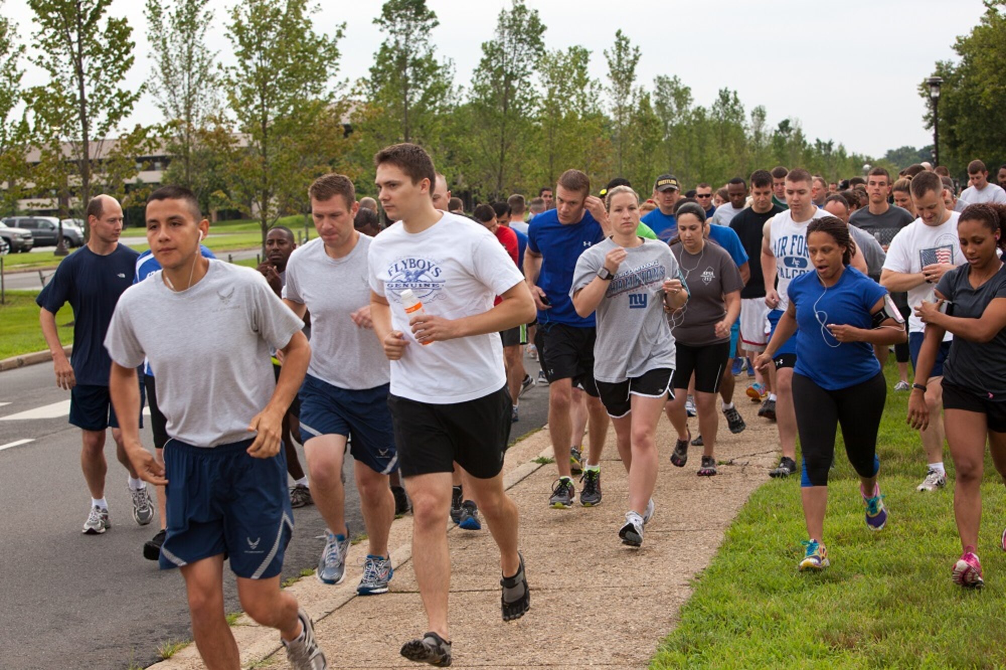 Members of the Joint Base McGuire-Dix-Lakehurst community join together and support the worldwide tanker community to run a 5K to honor the memories of KC-135 crew, Shell 77 and raise money for the families left behind as a result of this tragedy July 12, 2013, on JB MDL, N.J. Capt. Mark T. “Tyler” Voss, Capt. Victoria A. “Tori” Pinckney, and Tech. Sgt. Herman “Tre” Mackey III perished May 3, 2013, when their KC-135 Stratotanker crashed in northern Kyrgyzstan. All three were deployed to the 376th Air Expeditionary Wing's 22nd Expeditionary Air Refueling Squadron from Fairchild Air Force Base, Wash., in support of Operation Enduring Freedom. (U.S. Air Force photo by Wayne Russell/Released)
