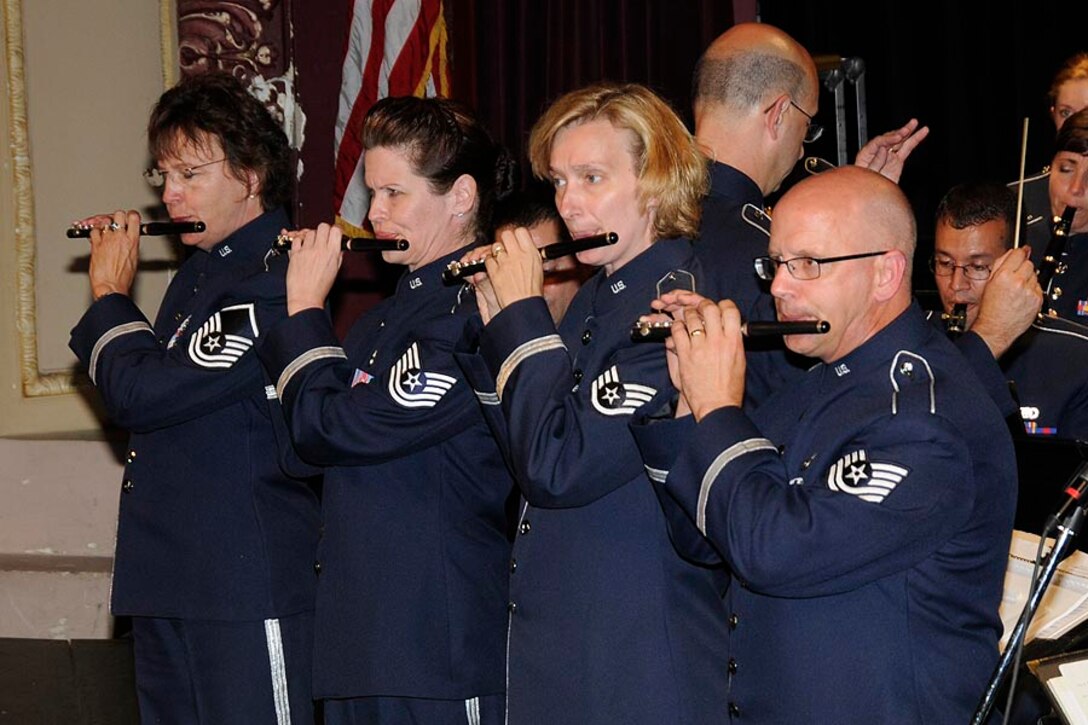 MSgt deTorres, TSgt Frioux, SSgt Foster, and TSgt Holzen play the piccolo soli from "Stars and Stripes".

Photo courtesy of TSgt Todd Pendleton, 182nd AW Public Affairs