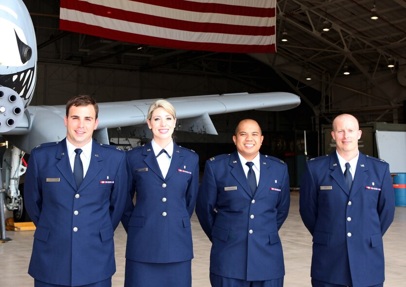 (From left to right) Capt. J. Brett Ryan, Capt. Megan Rickert, Capt. Christopher Hinahon and Capt. Stephen Boh, pose for a group photo on Barksdale Air Force Base, La., in this undated file photo. The captains participated in Barksdale’s Advanced Education in General Dentistry residency program and will graduate during a ceremony at 10 a.m. July 26, at the base’s Chapel 2 Annex. (Courtesy photo)