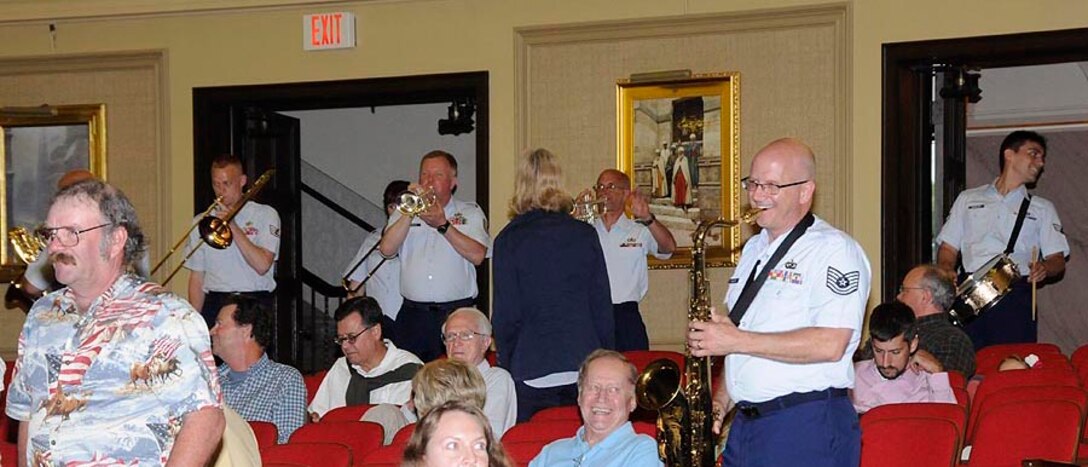 Harmony in Blue enters after intermission, playing "Second Line" while walking to the stage.

Photo courtesy of TSgt Todd Pendleton, 182nd AW Public Affairs