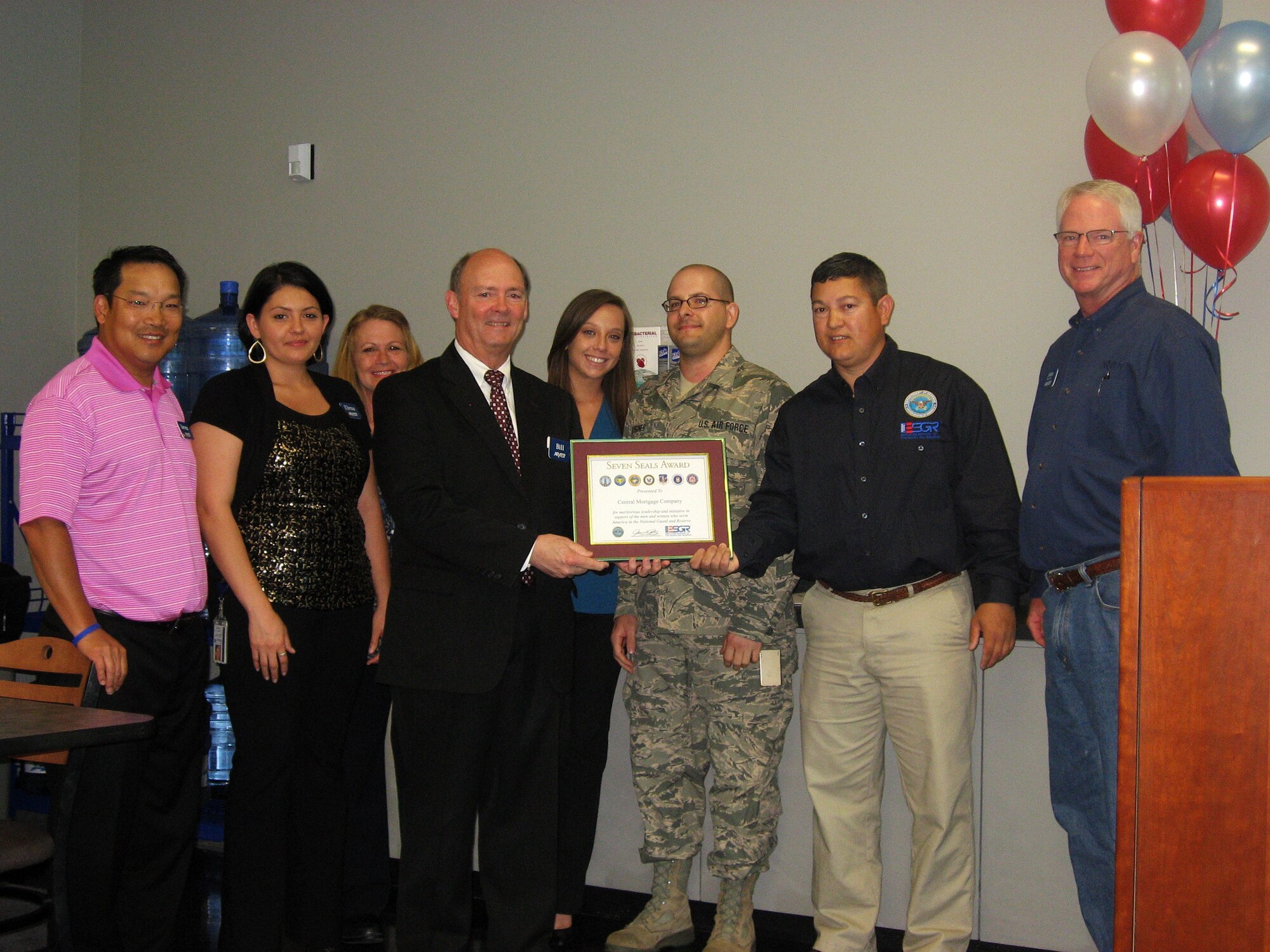 From left: Steven Plaisance, Arvest Mortgage president; Elena Oseguera, Arvest employee; Judi Acord, Arvest employee; Bill Roehrenbeck, Arvest Mortgage chairman; Alex Henry, Arvest employee; Master Sgt. Jon Surginer of the 188th Aircraft Maintenance Squadron; Master Sgt. Brian Anible, 188th Mission Support Group 1st Sgt and Arkansas Committee for Employer Support of the Guard and Reserve volunteer; John Womack, Arvest Bank president (Little Rock). Arvest Mortgage was presented a Patriot Award for being highly supportive of Surginer’s career in the 188th Fighter Wing. The Seven Seals Award is the broadest and most inclusive award given by ESGR, as it may be awarded to employers, ESGR staff members and volunteers, or any person or entity that significantly advances the ESGR mission.  It is presented at both the state and national levels to honor significant individual or organizational achievement, initiative, or support that promotes and supports the ESGR mission, to include the efforts of the more than 4,900 volunteers who carry out ESGR’s mission across the Nation on a daily basis. To nominate your employer for an award, go to http://www.esgr.mil/Employer-Awards/ESGR-Awards-Programs.aspx. (courtesy photo)