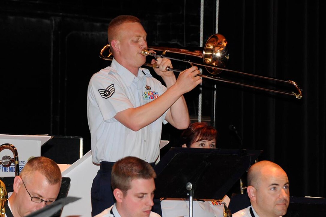 SSgt Kurt Dieringer stands to solo during the concert.

Photo courtesy of TSgt Todd Pendleton, 182nd AW