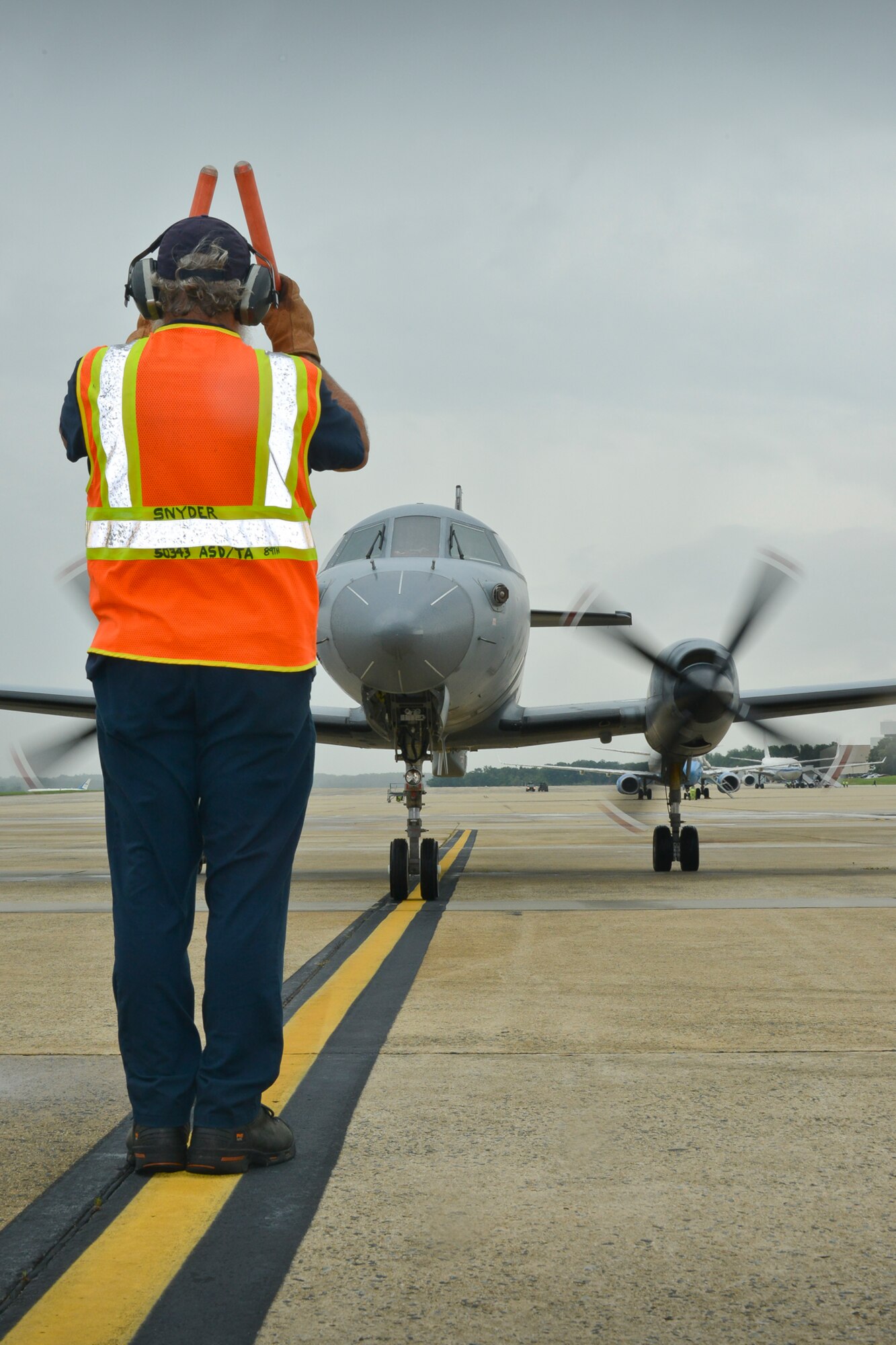 An Air Force RC-26 aircraft is marshaled into position at Joint Base Andrews, Md., July 12, 2013, after returning from operations in Southwest Asia and the Area of Responsibility. The RC-26 aircraft, a highly mobile intelligence, surveillance, and reconnaissance platform flown solely by the ANG and operated under the 45th Expeditionary Special Operations Squadron, provided U.S. Special Operations Command with more than 45,000 combat hours flown in support of Operation Iraqi Freedom, Operation Enduring Freedom, and Operation New Dawn that resulted in Air Guardsmen receiving more than 1,000 Air Medals, 15 Bronze Star Medals, and 15 Combat Action Medals for ANG personnel. (U.S. Air National Guard photo by Master Sgt. Dennis Young/RELEASED)