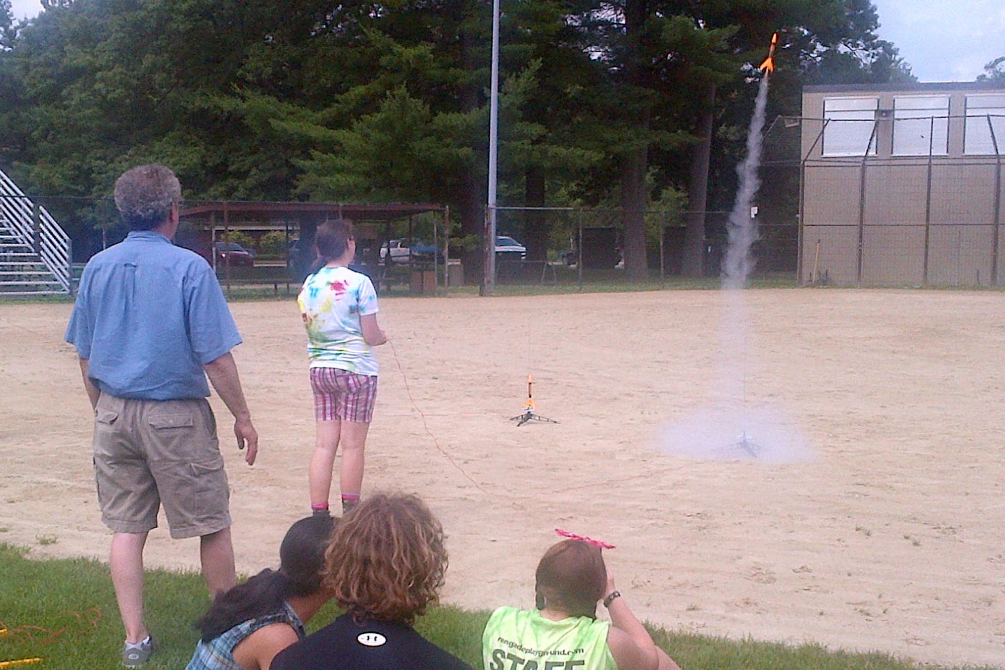HANSCOM AIR FORCE BASE, Mass. -- Students from the Hanscom Middle School participated recently in a rocket box program with members of the Lexington-Concord Chapter of the Armed Forces Communications and Electronics Association young AFCEANs on base June 26. Through a “rocket box” grant, students were provided the resources from AFCEA to hold a rocket week at the middle school that enabled them to apply the science they learned in the classroom to a hands-on experience. (Courtesy photo)