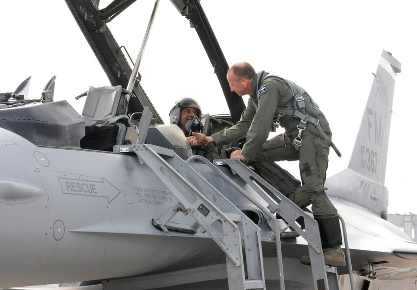 Chief Master Sgt. Cameron B. Kirksey, Air Force Reserve Command command chief master sergeant, receives well wishes from Col. Donald R. Lindberg, 10th Air Force vice commander, before an F-16 familiarization flight at Homestead Air Reserve Base, Fla., July 12. (U.S. Air Force photo/Senior Airman Jaimi Upthegrove)