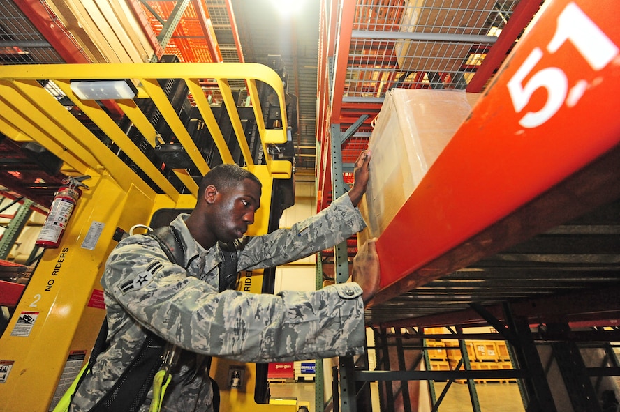 Airman 1st Class Terrell Grant, 509th Logistics Readiness Squadron central storage journeyman, inspects a box encasing an electrostatic device to ensure it is properly packaged at the central storage warehouse at Whiteman Air Force Base, Mo., June 25, 2013. If boxes in the warehouse aren’t packaged correctly, Grant sends them to the Traffic Management Office, where they can be re-sealed. (U.S. Air Force photo by Staff Sgt. Nick Wilson/Released)