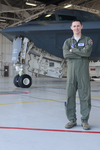 U.S. Air Force Maj. Jasen Hunter, 394th Combat Training Squadron B-2 Spirit pilot, stands in front of the "Spirit of Florida" prior to his first-ever B-2 flight at Whiteman Air Force Base, Mo., July 10, 2013. Hunter first saw the B-2 in flight while in high school and made it his mission to one day fly the B-2. On July 10, he took flight in the "Spirit of Florida," the very aircraft he had seen fly over in 1996. (U.S. Air Force photo by Staff Sgt. Jason Huddleston/Released)
