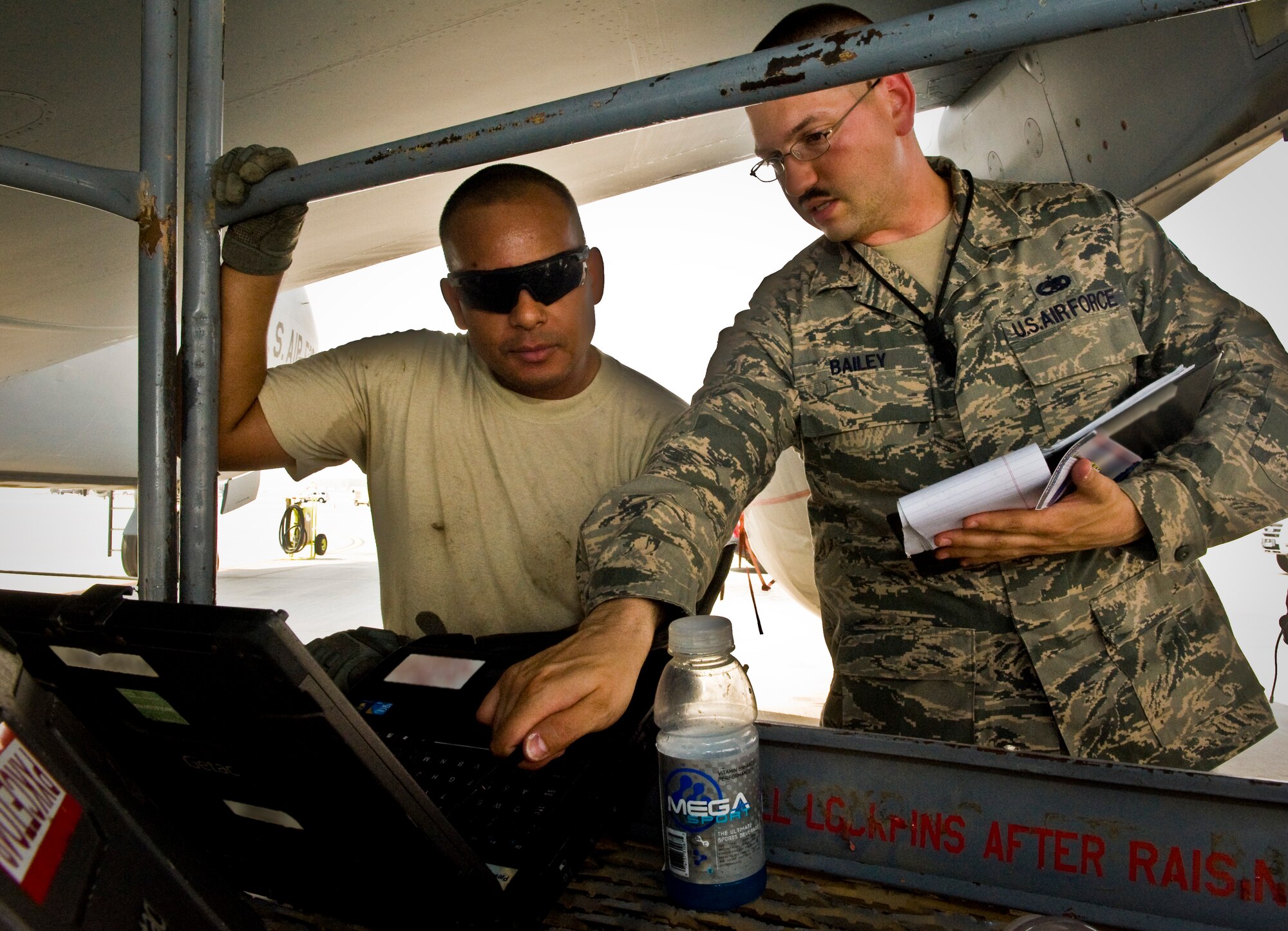 Tech. Sgt. Jeffrey Bailey ensures Staff Sgt. David Garcia is entering task data on his technical order correctly at the 379th Air Expeditionary Wing in Southwest Asia, July 15, 2013. Bailey is a 379th Expeditionary Maintenance Group quality assurance inspector deployed from Mountain Home Air Force Base, Idaho, and Garcia is a 379th Expeditionary Maintenance Squadron repair and reclamation specialist deployed from McConnell Air Force Base, Kan. (U.S. Air Force photo/Senior Airman Benjamin Stratton)
