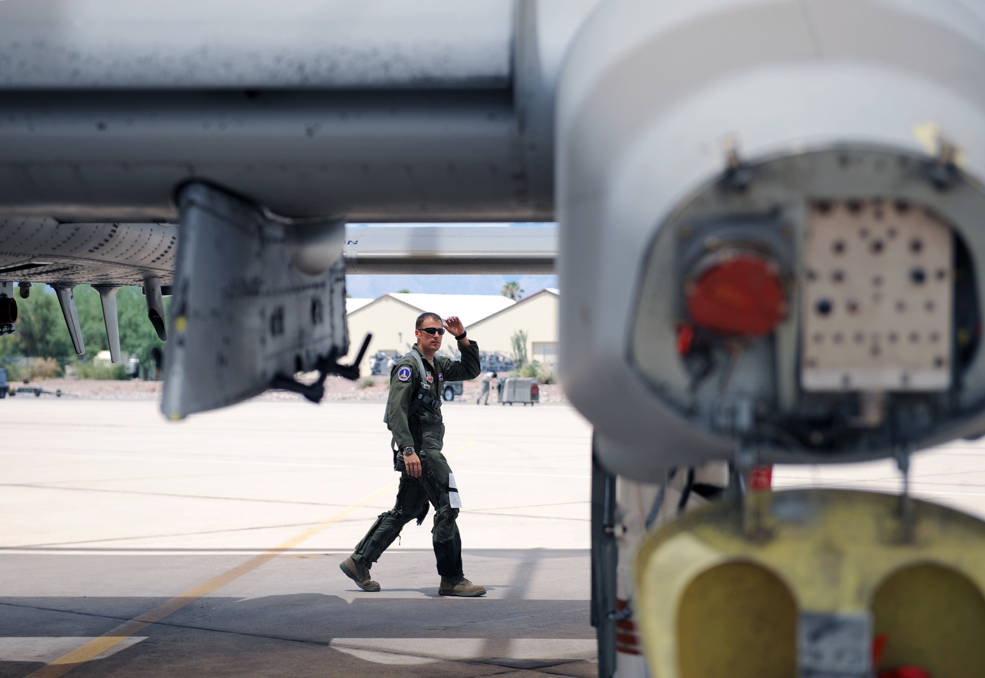 1st Lt. Pete Matthews, 354th Fighter Squadron fighter pilot, performs pre-flight checks on his A-10 on the flightline at Davis-Monthan Air Force Base, Ariz., July 17, 2013. The 354th FS recently returned to flying after being grounded for three months due to sequestration. (U.S. Air Force photo by Airman 1st Class Saphfire Cook/Released)