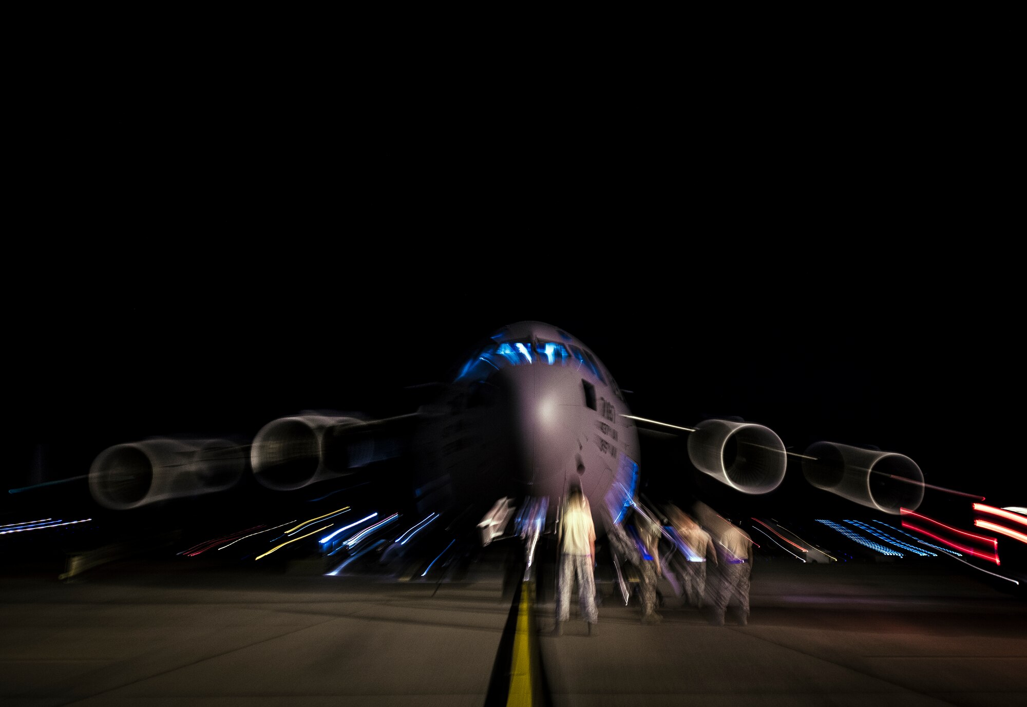 Aircrew members perform pre-flight checks on a C-17 Globemaster III before take-off to practice combat on-loading and off-loading July 17, 2013, at Joint Base Charleston – Air Base, S.C. Airmen from the 437th Airlift Wing work around the clock on the flightline to provide combat-ready C-17A aircrews, mission support personnel and processes for 53 assigned aircraft to meet White House, Department of State and Joint Chiefs of Staff-directed global deployment, employment and resupply of Department of Defense and allied forces via air-land and airdrop operations. (U.S. Air Force photo/ Senior Airman Dennis Sloan)