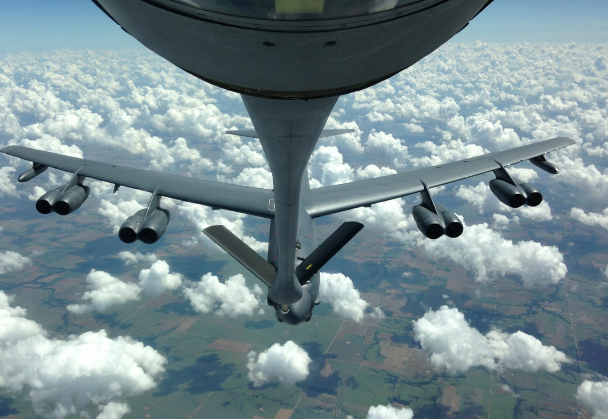 A B-52 Stratofortress from the 5th Bomb Wing out of Minot AFB, N.D prepares to take on a fuel load from a KC-135 Stratotanker flown by the 18th Air Refueling Squadron out of McConnell Air Force Base, Kan., July 18, 2013. (Air Force photo by Senior Master Sgt. Ray Lewis)