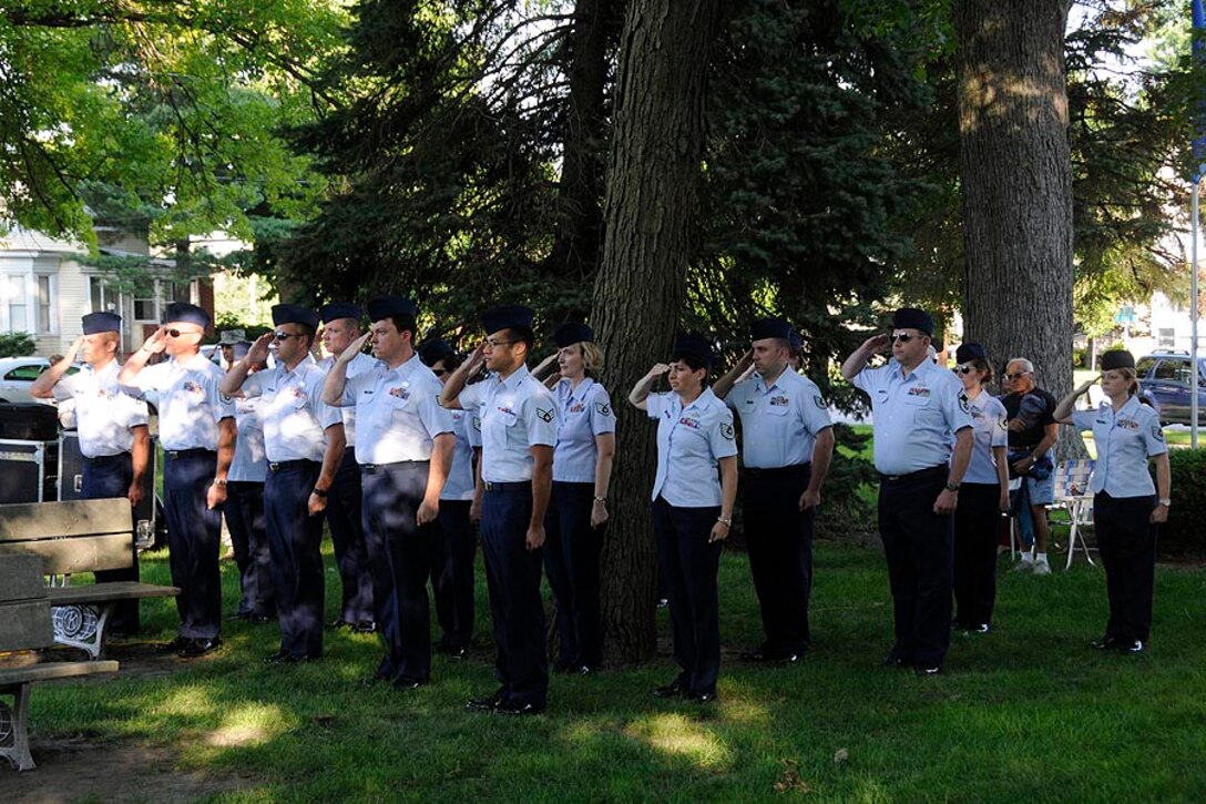 Band members saluting during the National Anthem.

Photo courtesy of TSgt Todd Pendleton, 182nd AW Public Affairs