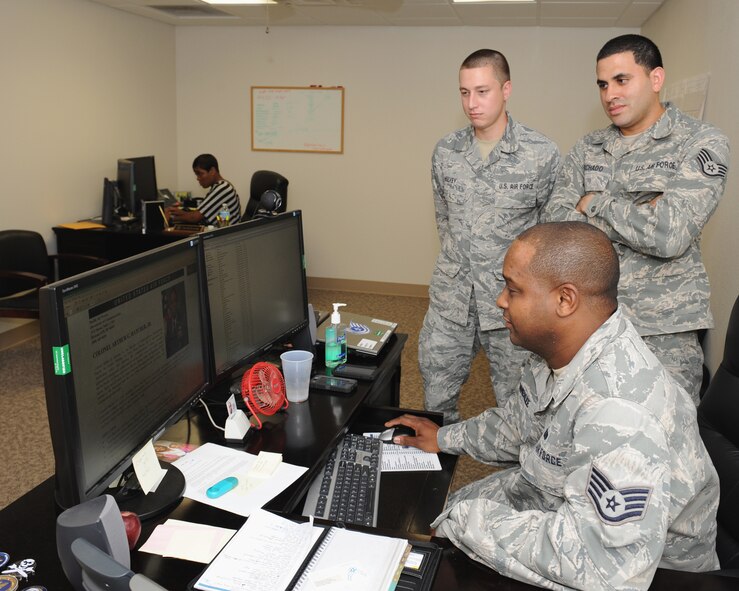 Staff Sgt. Stepheno Pomerlee, 2nd Communications Squadron executive communications flight, trains two Airmen on remote tooling on Barksdale Air Force Base, La., July 11, 2013. The executive communications flight provides information technology support to Air Force Global Strike Command, 8th Air Force, the 2nd and 307th Bomb Wings as well as group commanders and their support staff. (U.S. Air Force photo/Airman 1st Class Benjamin Gonsier)