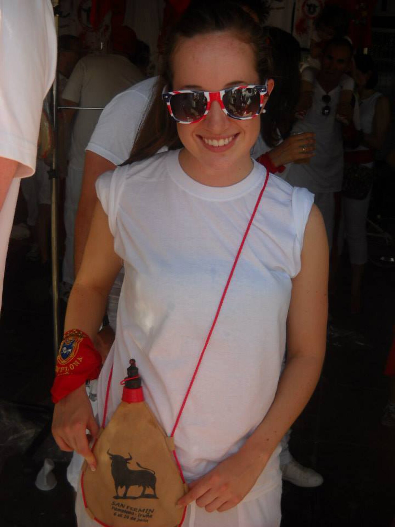 Regardless of whether or not individuals participate in the run, locals and tourists alike must dress in all white with red scarves and belts. Many participants also carry brown sacks filled with water or sangria.(Courtesy photo)