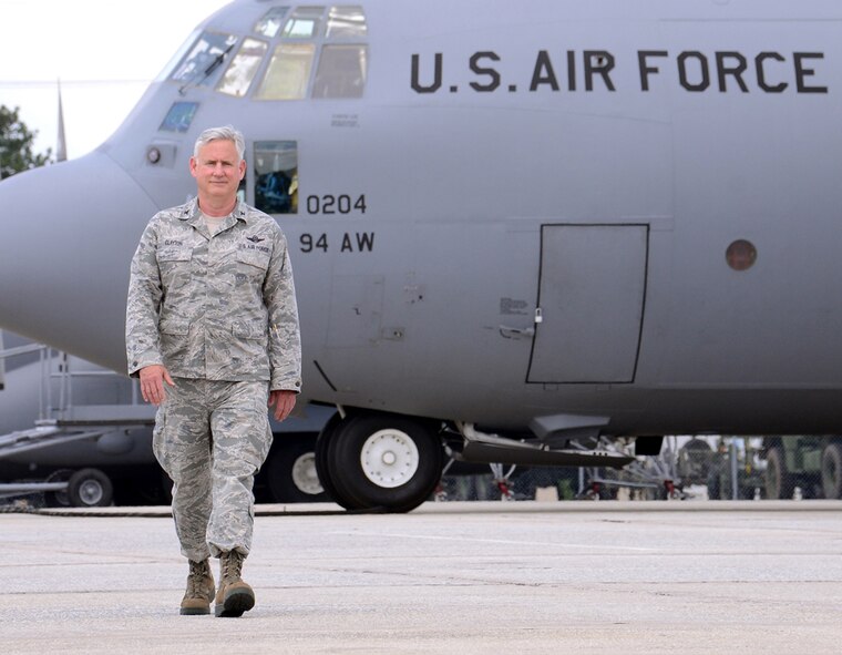 Col. Steven R. Clayton, 94th Operations Group commander walks past a Dobbins C-130 for the final time June 24. Clayton retired after 30 years of service to the U.S. Air Force. (U.S. Air Force photo/Brad Fallin)