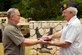 Master Sgt. Jeff Walston, a public affairs technician assigned to the 307th Bomb Wing at Barksdale Air Force Base La., presents a tattered U.S. flag to Bill Walston, 1st Vice Commander, American Legion Post 418, at the American Legion post in Troup, Texas, July 4, 2013. Sergeant Walston received the flag from one of the managers of the Silver Star Restaurant in Bossier City, La., after he noticed the flag was damaged. The American Legion post in Troup accepts flags to be retired from individuals and organizations, and once or twice a year retires them with the assistance of a local Boy Scout Troop. (Courtesy photo by Eva Klimentova)  