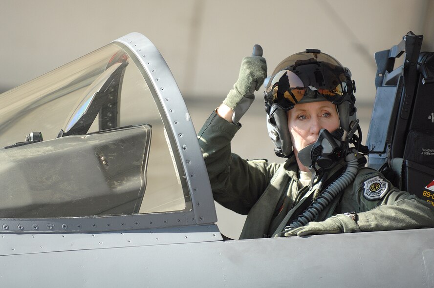 U.S Air Force Col. Jeannie Leavitt, 4th Fighter Wing commander, signals her crew chief before taking flight at Seymour Johnson Air Force Base, N.C., July 17, 2013.  After being stood down for more than three months, the 336th Fighter Squadron was finally given the green light to resume flying hours and return to combat mission ready status.  (U.S. Air Force photo by Airman 1st Class Brittain Crolley/Released)