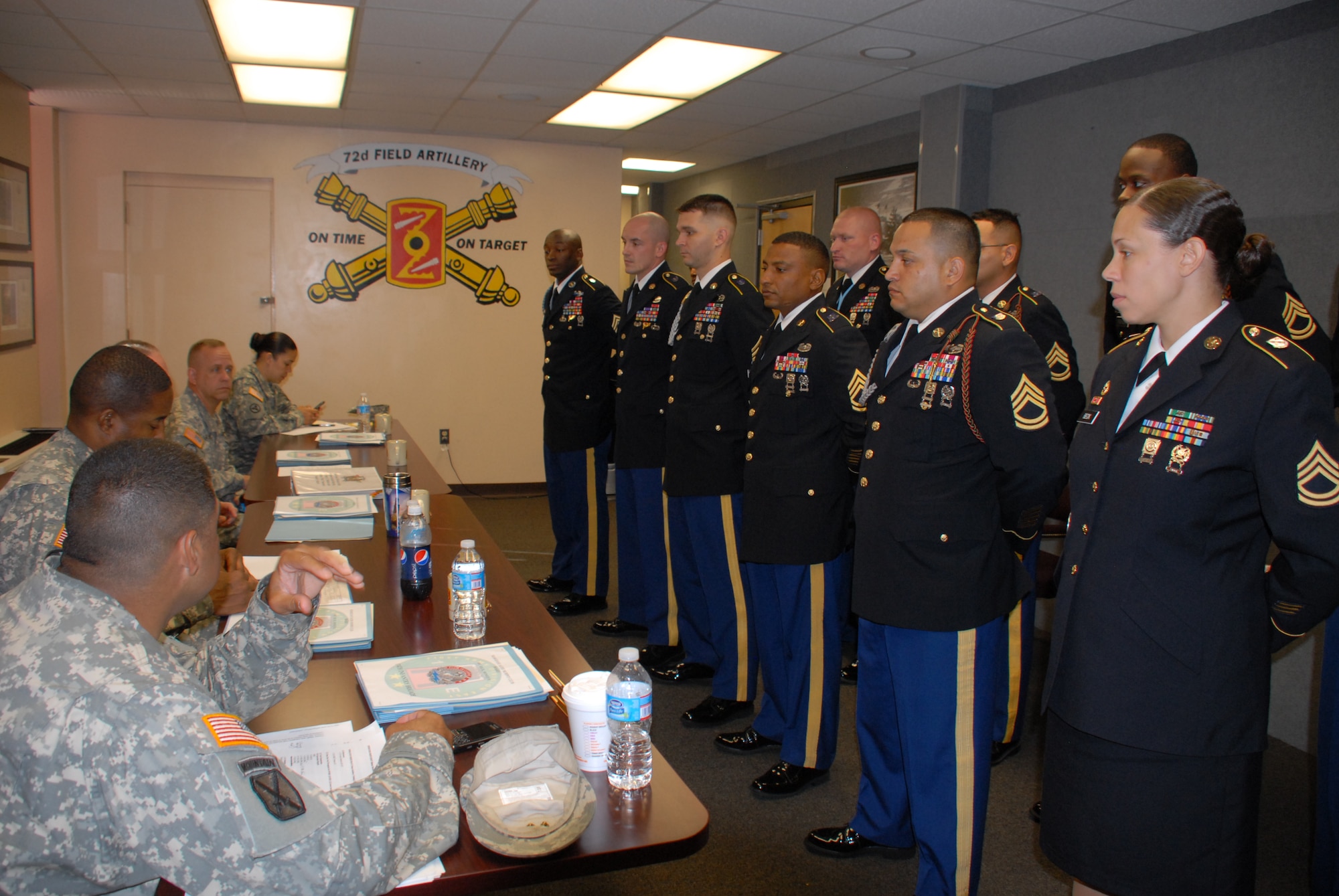 Members of the First Army Division East Sgt. Audie Murphy board brief Soldiers of the 72nd Field Artillery Brigade and the 174th Infantry Brigade, July 15, 2013, at Joint Base McGuire-Dix-Lakehurst, N.J. The candidates appeared before the board individually, in hopes of being recommended for membership in the elite organization. (U.S. Army photo by Staff Sgt. Nicole Dykstra/Released)