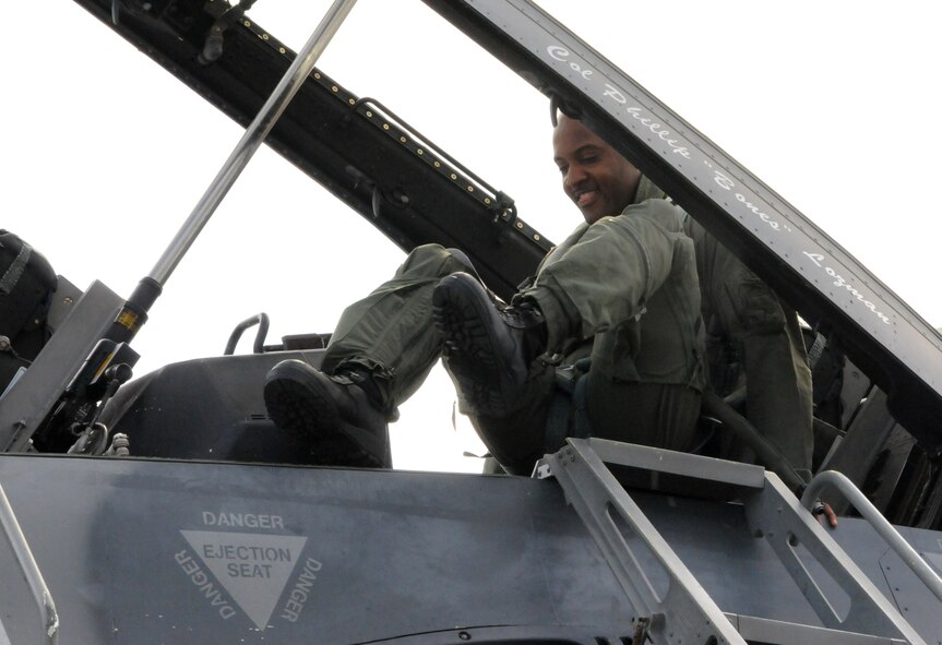 Chief Master Sgt. Cameron B. Kirksey, Air Force Reserve Command command chief master sergeant, climbs into the cockpit of an F-16 for his familiarization flight with Col. Donald R. Lindberg, 10th Air Force vice commander, at Homestead Air Reserve Base, Fla., July 12. (U.S. Air Force photo/Senior Airman Jaimi Upthegrove)