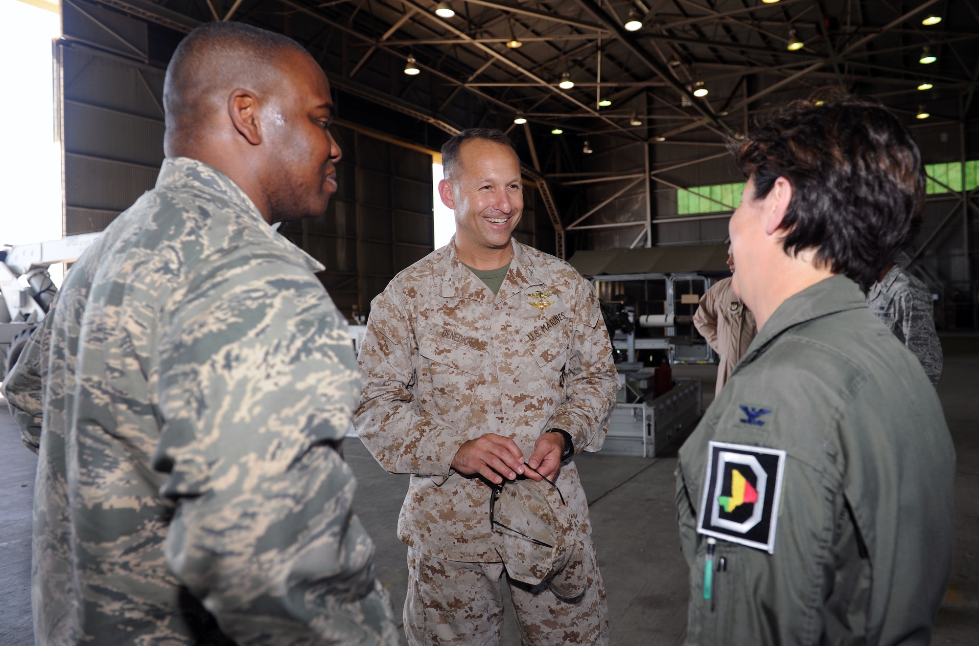 From left, Col. Earl Scott, 100th Maintenance Group commander; U.S. Marine Corps Col. Scott Benedict, Special Purpose Marine Air Ground Task Force commanding officer; and Col. Nancy Bozzer, 100th Operations Group commander, meet July 16, 2013, at Moron Air Base, Spain. Bozzer and Scott spoke with Benedict reviewed mission progress, and addressed needs of the base. (U.S. Air Force photo by Airman 1st Class Preston Webb/Released)