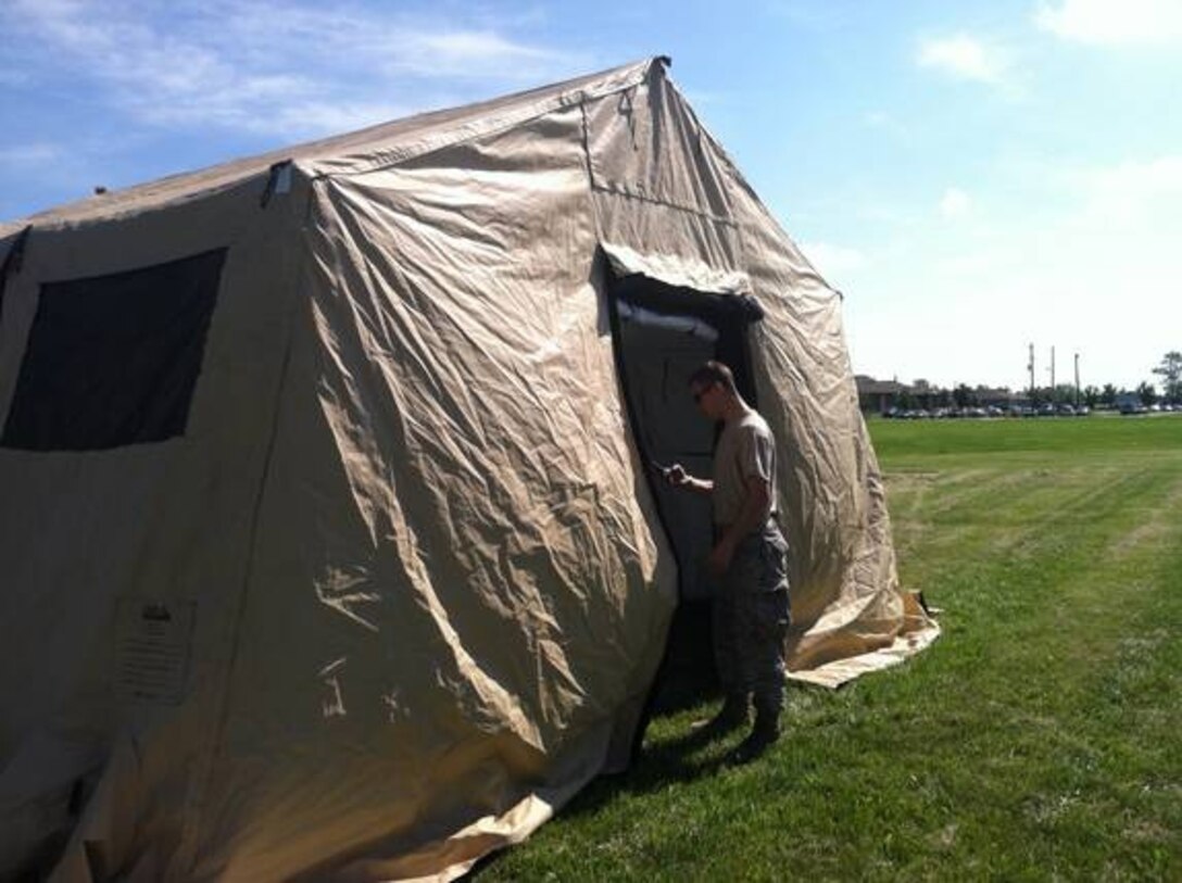 Senior Airman Brett Schickler of the 914th Communications Squadron checks for power and connectivity during a Site Communications Exercise July 13 during the Unit Training Assembly at the Niagara Falls Air Reserve Station, N.Y.  The squadron trained the Airmen in proper construction of a Joint Interoperability Site Communication Capability Package. (U.S. Air Force photo by Senior Airman Daniel Becker)