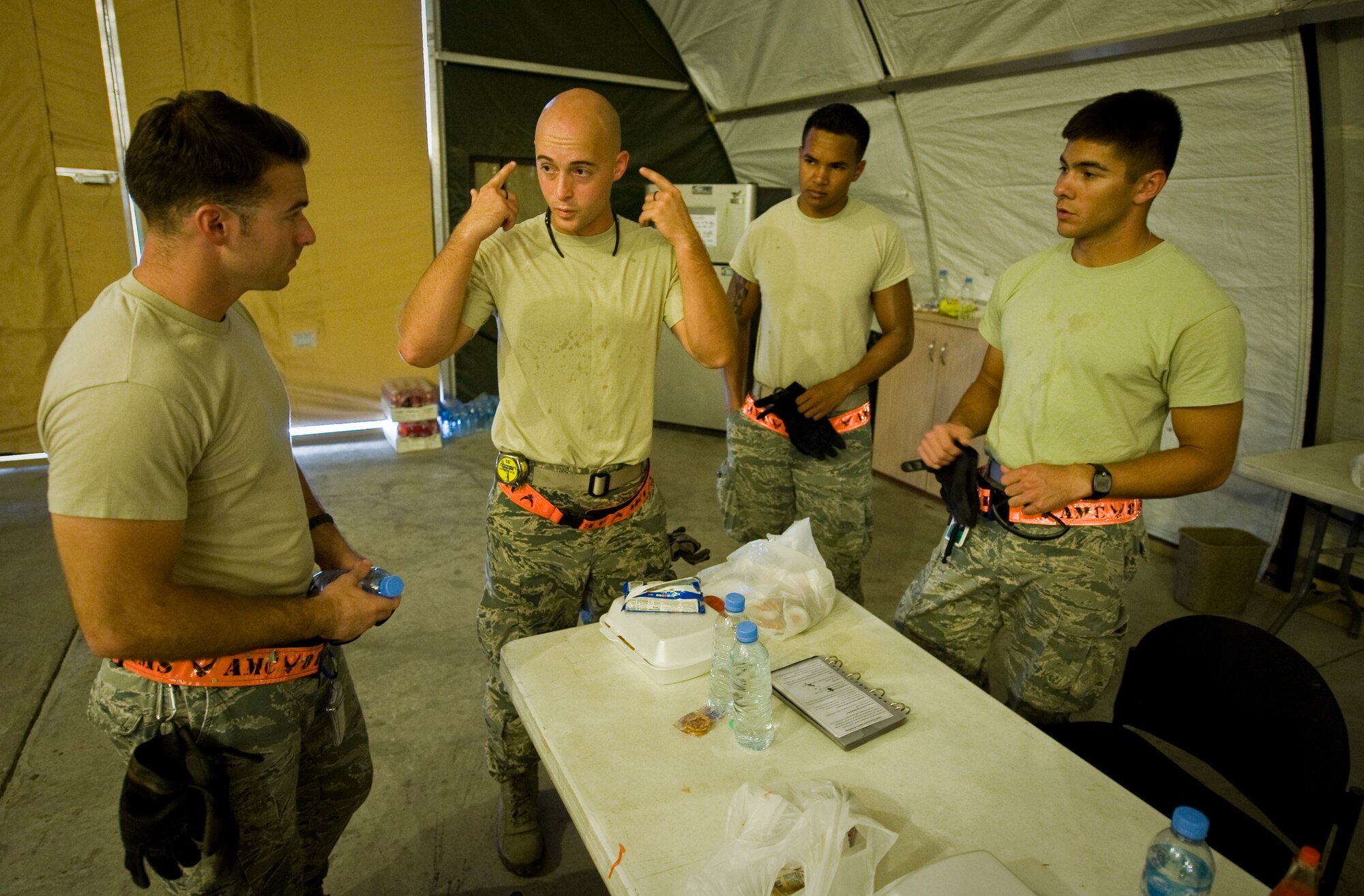 Staff Sgt. Adam Rozehnal briefs his team on safety requirements prior to loading cargo and equipment onto a C-17 Globemaster III at the 379th Air Expeditionary Wing in Southwest Asia, July 17, 2013. Rozehnal is an 8th Expeditionary Air Mobility Squadron air transportation supervisor deployed from Joint Base McGuire-Dix-Lakehurst, N.J. (U.S. Air Force photo/Senior Airman Benjamin Stratton)