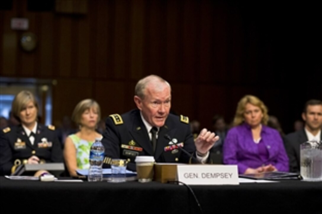 Army Gen. Martin E. Dempsey, chairman of the Joint Chiefs of Staff, testifies on his nomination to serve a second two-year term during a hearing before the Senate Armed Services Committee in Washington, D.C., July 18, 2013. 