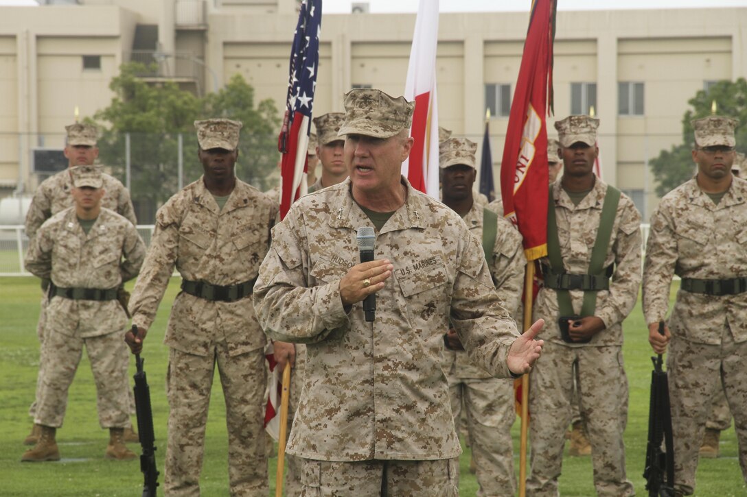 Maj. Gen. Charles L. Hudson, Marine Corps Installations Pacific commanding general, addresses the crowd during the Marine Corps Air Station Iwakuni change of command ceremony, July 12, 2013 at the MCAS Iwakuni parade deck. Hudson visited MCAS Iwakuni, June 21, to present the Achievement in Safety award to Col. James C. Stewart, former MCAS Iwakuni commanding officer.