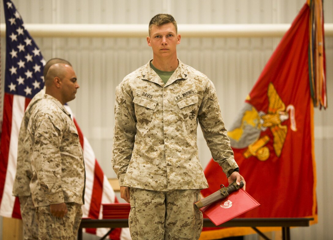 Lance Cpl. Andy Davis, a rifleman with Black Sea Rotational Force 13 and Richmond Hill, Ga., native, marches off the stage after receiving  a certificate and bayonet for being the honor graduate of Corporals Course class 44-13, June 23, 2013 out of Mihail Kogalniceanu Military Base, Romania.  Marines with BSRF-13 who attended Corporals Course learned the basics of being a non-commissioned officer in the United States Marine Corps. Corporals Course is a formal school that is a requirement for all corporals that want to be eligible for the rank of sergeant.