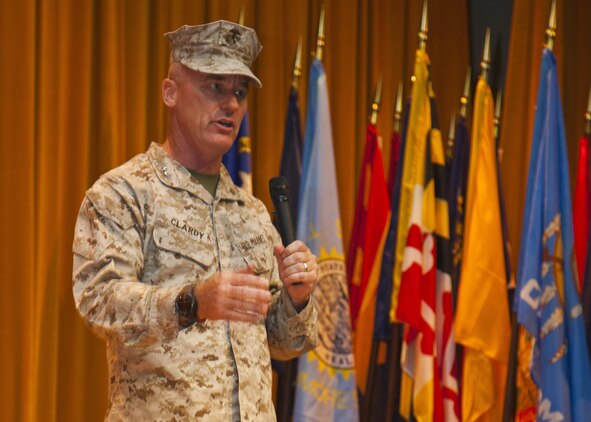 Maj. Gen. H. Stacy Clardy III speaks to Japanese officials and U.S. Marines and sailors during the 3rd Marine Division change of command ceremony July 12 at the Camp Courtney theater. “I am so honored and humble to have this opportunity. To get the chance to come here, to this inspiring division, and take over for a good friend of mine is quite an honor for me,” said Clardy. “I very much look forward to serving with the finest division in the Marine Corps, and I look forward to the challenges ahead.” Clardy’s previous assignment was at Headquarters, U.S. Marine Corps where he served as the Director of Operations with Plans, Policies and Operations. Padilla’s next command will be at Headquarters, U.S. Marine Corps where he will serve as the Director of Operations with Plans, Policies and Operations. The division is part of III Marine Expeditionary Force. (U.S. Marine Corps photo by Lance Cpl. Brandon C. Suhr/Released)