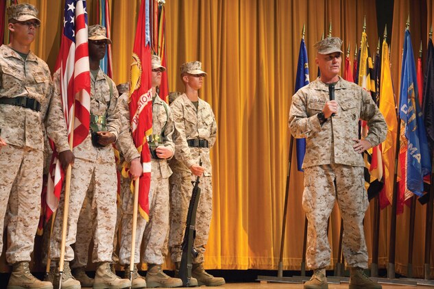 Maj. Gen. H. Stacy Clardy III speaks to gathered Japanese officials and U.S. Marines and sailors during his assumption of command at the 3rd Marine Division change of command ceremony July 12 at the Camp Courtney theater. “I am so honored and humble to have this opportunity. To get the chance to come here, to this inspiring division, and take over for a good friend of mine is quite an honor for me,” said Clardy. “I very much look forward to serving with the finest division in the Marine Corps, and I look forward to the challenges ahead.” Clardy’s previous assignment was at Headquarters, U.S. Marine Corps where he served as the Director of Operations with Plans, Policies and Operations. Padilla’s next command will be at Headquarters, U.S. Marine Corps where he will serve as the Director of Operations with Plans, Policies and Operations. The division is part of III Marine Expeditionary Force. (U.S. Marine Corps photo by Lance Cpl. Brandon C. Suhr/Released)