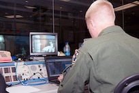 Capt. Kenneth Moerscher, a representative on the Joint Task Force Space - Transportation System team from the Air Force Rescue Coordination Center, monitors a shuttle launch from the Morrell Operations Center at Cape Canaveral Air Force Station, Fla. 