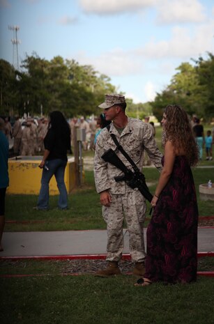 Sgt. Jared R. McManus, an automotive organizational mechanic with Combat Logistics Battalion 6, 2nd Marine Logistics Group, waits with his wife for buses, which service members with CLB-6 will board at the start of a deployment to Afghanistan aboard Camp Lejeune, N.C., July 10, 2013. Service members with the unit departed the United States throughout several days on a half-year mission to provide tactical logistics support to units operating throughout Regional Command Southwest as they continue to advise and assist the Afghan National Security Forces.