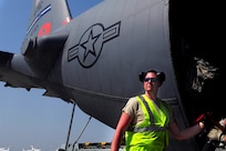 U.S. Air Force Staff Sgt. Shane Sturgeon fills up a C-130 Hercules's Modular Airborne Fire Fighting System aircraft with fire retardant before it departs here, April 17, 2011, to support firefighting against the wildfires in Texas.  Sergeant Sturgeon is a maintainer assigned to the 302nd Aircraft Maintenance Squadron out of Peterson AFB, Colo.  