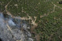 u A wildfire burns land near Austin, Texas, April 17, 2011. U.S. Northern Command has deployed six C-130 aircraft fitted with the U.S.D.A. Forest Service’s Modular Airborne Fire Fighting Systems to support the fight against ongoing wildfires. 