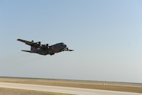 A C-130 equipped with a U.S.D.A. Forest Service Modular Airborne Fire Fighting System departs here April 17, 2011 to fight a wildfire in a neighborhood in Austin. U.S. Northern Command has deployed six C-130 aircraft fitted with MAFFS to support the battle against ongoing wildfires in the area. 