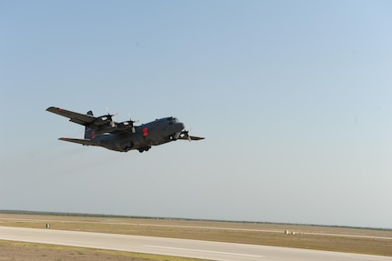 A C-130 equipped with a U.S.D.A. Forest Service Modular Airborne Fire Fighting System departs here April 17, 2011 to fight a wildfire in a neighborhood in Austin. U.S. Northern Command has deployed six C-130 aircraft fitted with MAFFS to support the battle against ongoing wildfires in the area. 