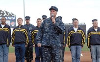 Navy Adm. James Winnefeld, North American Aerospace Defense Command and U.S. Northern Command commander, gives the oath of enlistment to 12 U.S. Navy enlistees at the Sky Sox - Grizzlies game at Security Services Field May 3. The Admiral was also invited to throw out the first pitch.
