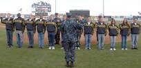 Navy Adm. James Winnefeld, North American Aerospace Defense Command and U.S. Northern Command commander, gives the oath of enlistment to 12 U.S. Navy enlistees at the Sky Sox - Grizzlies game at Security Services Field May 3. The Admiral was also invited to throw out the first pitch.
