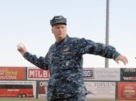 Navy Adm. James Winnefeld, North American Aerospace Defense Command and U.S. Northern Command commander, throws out the first pitch at the Sky Sox - Grizzlies game at Security Services Field May 3. The NORAD and USNORTHCOM commander also gave the oath of enlistment to 12 U.S. Navy enlistees. The Sky Sox beat the Grizzlies 13 - 5. 