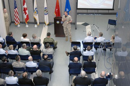 Marine Maj. Gen. Robert Walsh, U.S. Northern Command Operations Directorate director, welcomes members of the USNORTHCOM Standing Joint Force Headquarters to the Operations Directorate during the NC/SJFHQ disestablishment ceremony May 9. The NC/SJFHQ, the organization responsible for deploying the core of an emergency joint task force to contingencies across the country within six hours of mobilization, was folded into the USNORTHCOM Operations Directorate after seven years of operation as a separate directorate.
