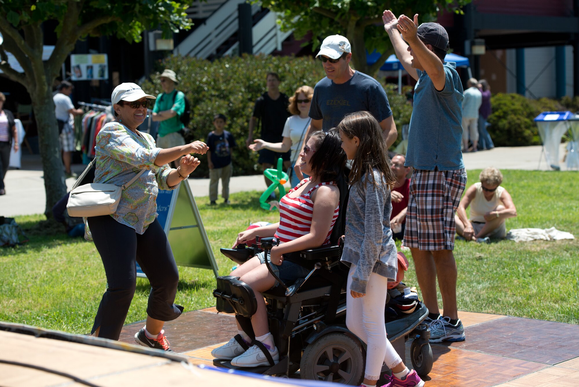 Delighted audience members utilize the special dance floor constructed for the community’s 4th of July 2013 Celebration at the Marina in Berkeley, Calif.  Live music was provided by The Blue Yonders, stationed at Travis Air Force Base, CA.  The Blue Yonders and several other ensembles of the USAF Band of the Golden West provided community concerts throughout the San Francisco Bay Area in honor of our nation’s Independence Day. (U.S. Air Force photo/ )