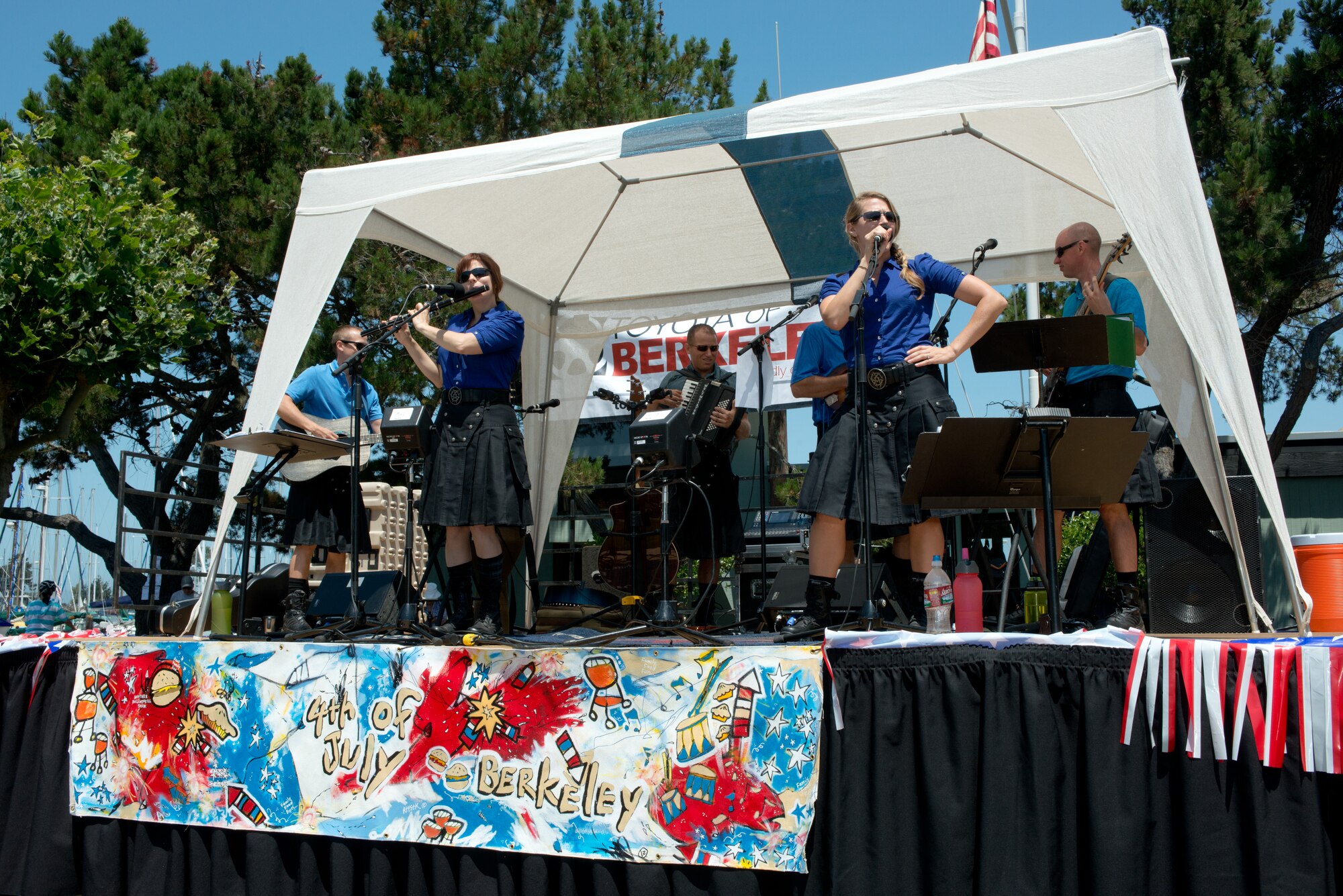 Seven band members comprising The Blue Yonders, the newest ensemble of the USAF Band of the Golden West stationed at Travis AFB, CA, entertain the audience with their unique blend of Irish folk-rock and pop favorites on July 4, 2013.  The Blue Yonders, comprised of seven active duty AF band members sporting authentic kilts and playing traditional instruments, specialize in Irish folk-rock as well as pop music favorites.  The group kicked off a full day of live performances for the local community, which took place at the Berkeley, CA Marina in honor of our nation’s Independence Day.